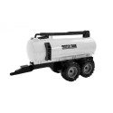 Traktor koos haagise, reha ja punase tankeriga