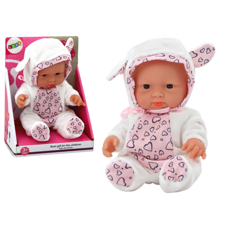 Väike beebinukk, valged riided, müts, vibu, kõrvad