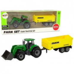 Väike roheline traktor kollase haagisega