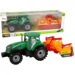Roheline traktor oranži kultivaatoriga lastele