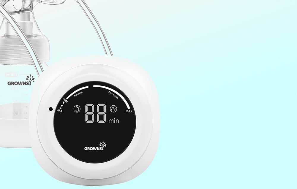 Close-up of the round control panel of the breast pump with a display showing the operating time in minutes