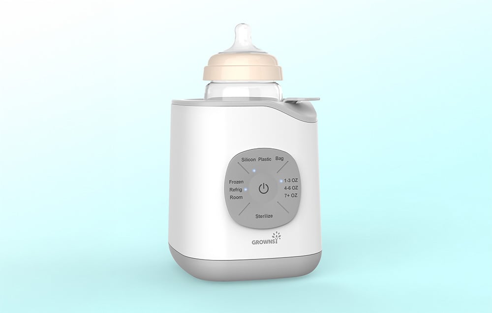 Bottle warmer with a bottle against a light blue studio background.