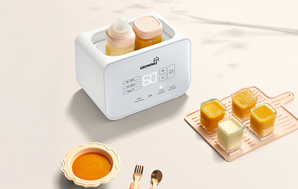 Bottle warmer with two bottles next to a food bowl and jars of baby food