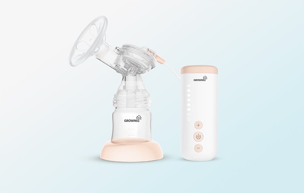Electric breast pump with bottle and separate control panel set against a light background